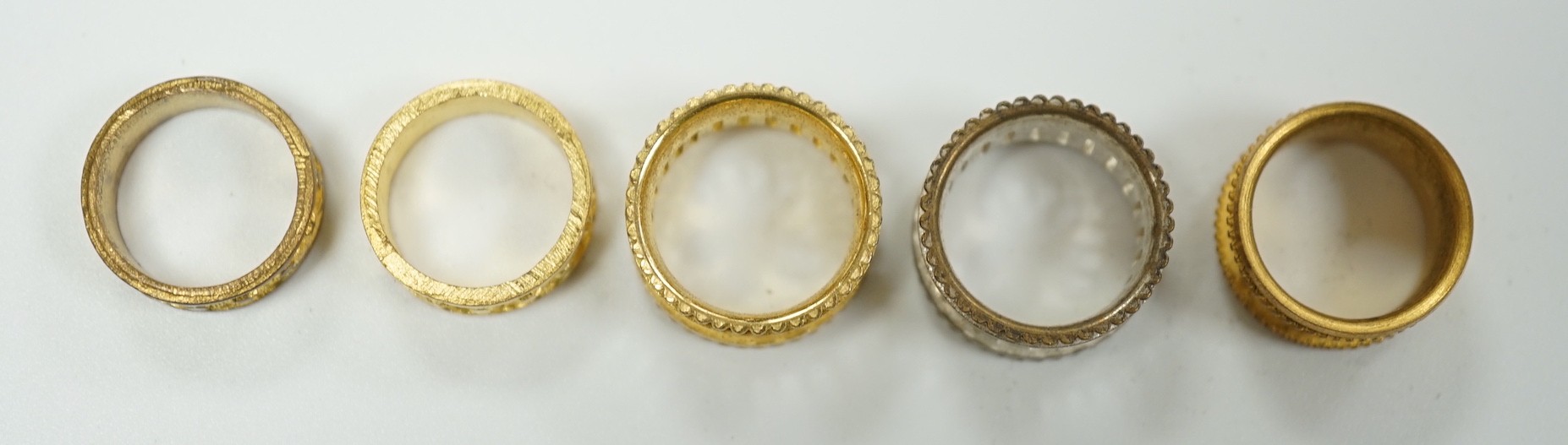 A rare Regency morocco leather mounted white metal cylindrical ring box containing five pinchbeck/base metal sample rings, box length 47mm.